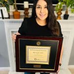 woman holding custom certificate frame