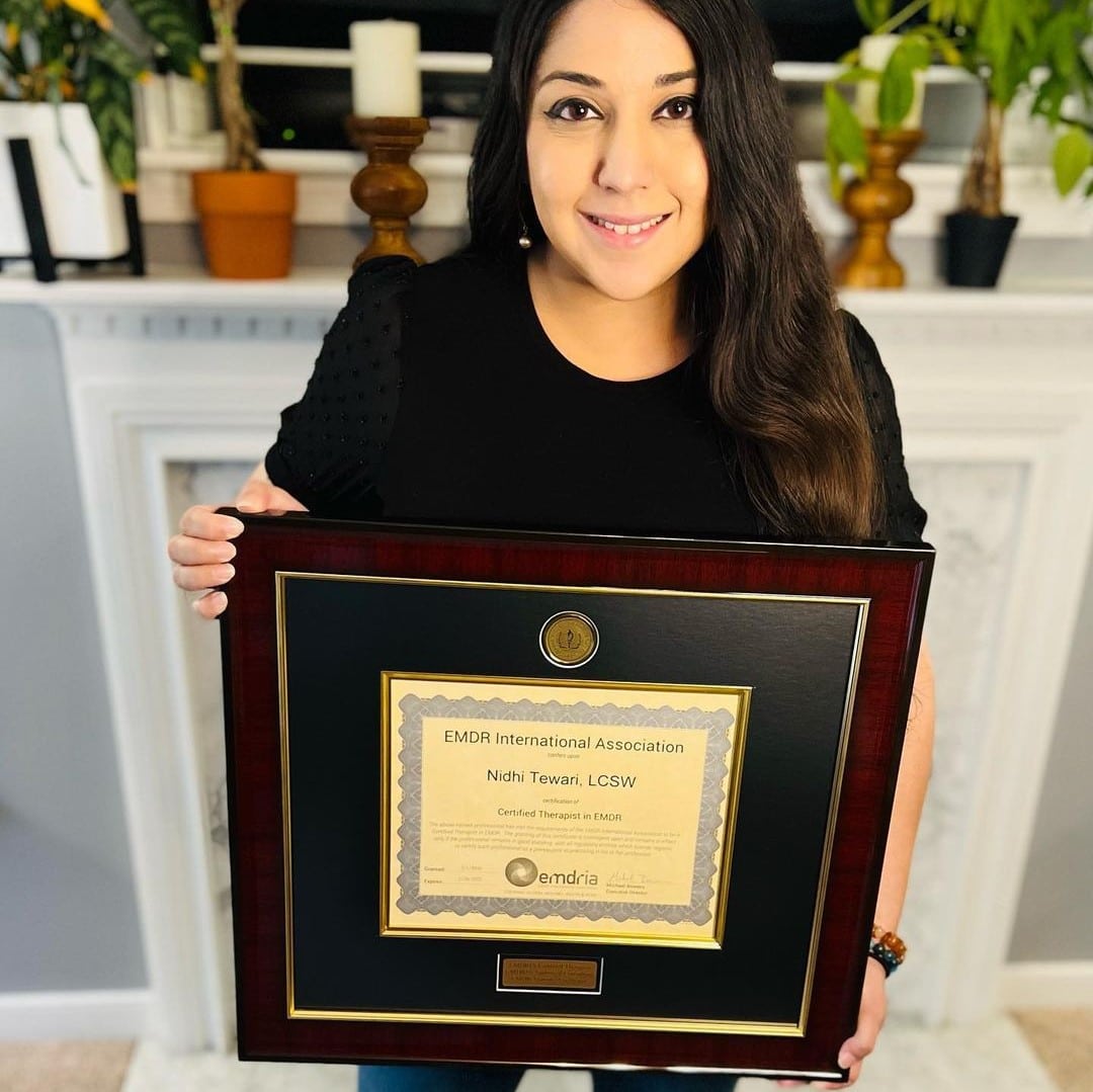 woman holding custom certificate frame