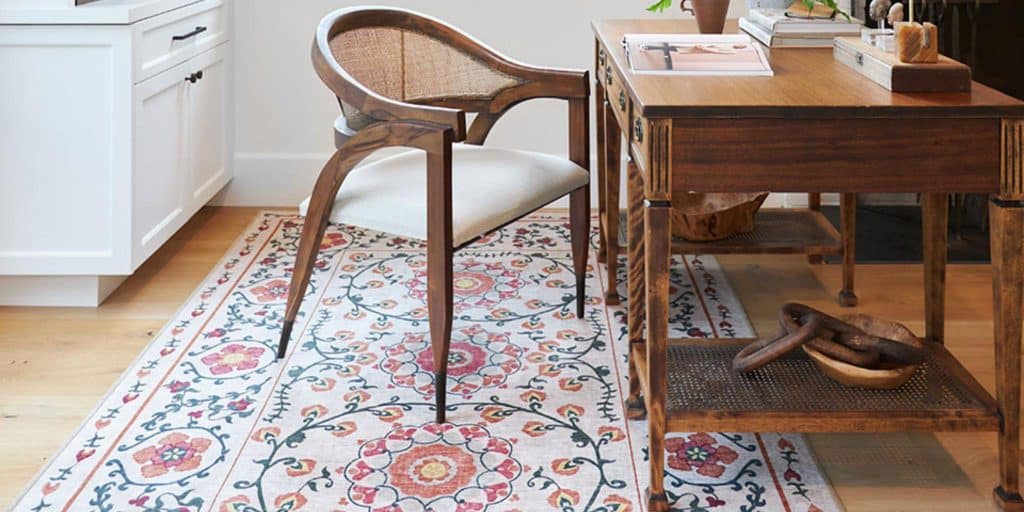 desk and chair with area rug beneath