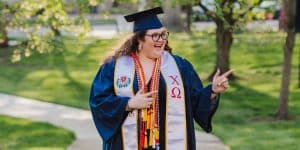 student graduating with honors on commencement day
