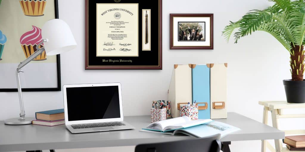 west virginia tassel frame and photo frame above personal desk in home