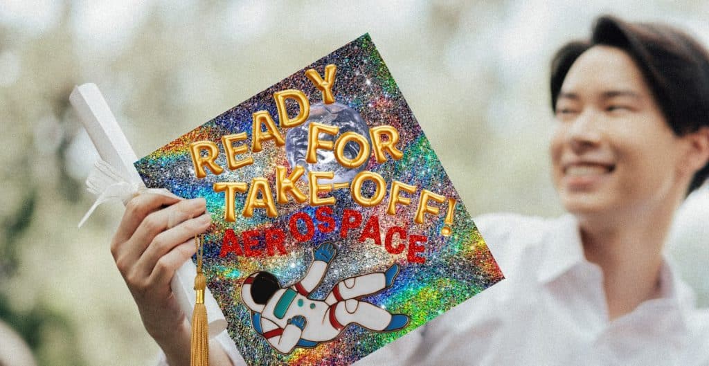 grad holding decorated aerospace grad cap