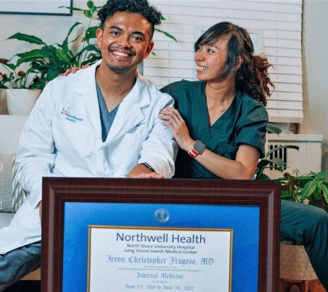 doctor and nurse with medical diploma frame