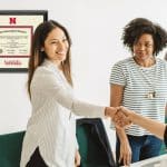new hire shaking hands with employer
