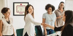 new hire shaking hands with employer
