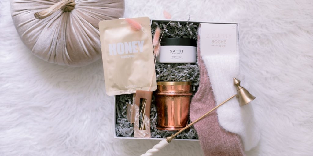 the basketry gift basket with hair clip candle and fuzzy socks