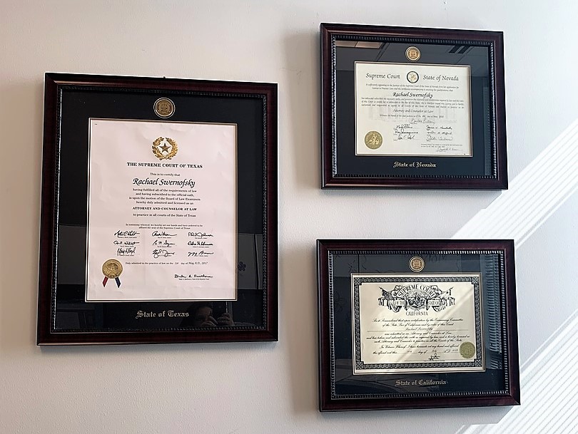 three state bar license frames on wall