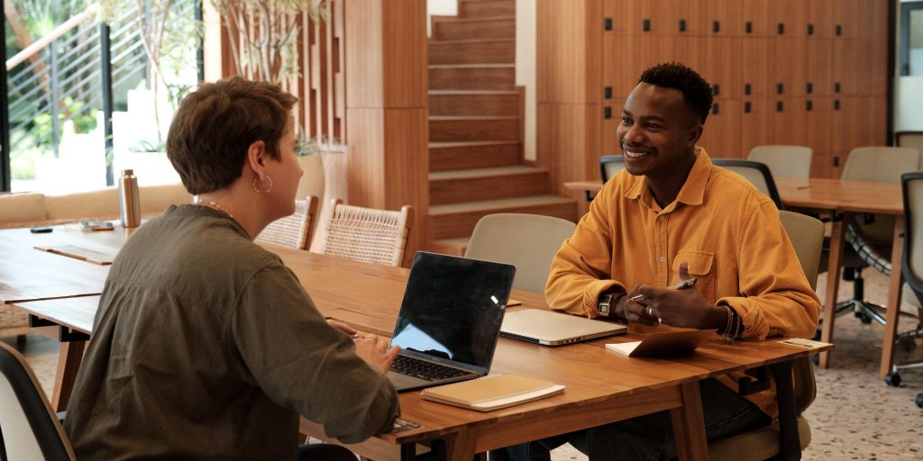a smiling interview candidate interviewing for a job