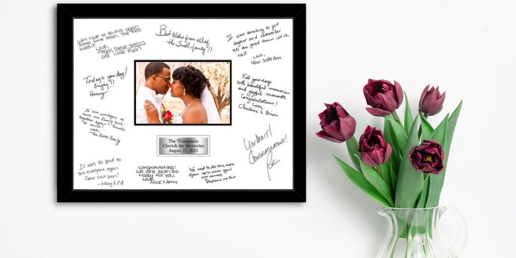 wedding couple photo in autograph frame on wall