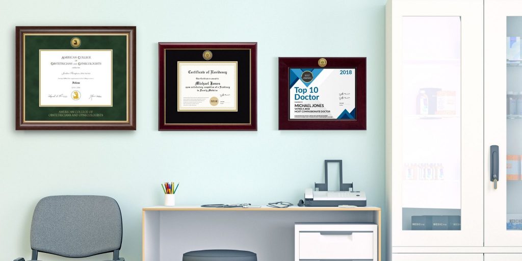 office with OBGYN license frames on wall