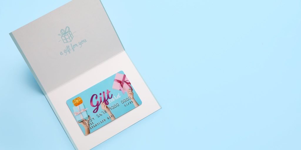 blue and pink gift card on blue background