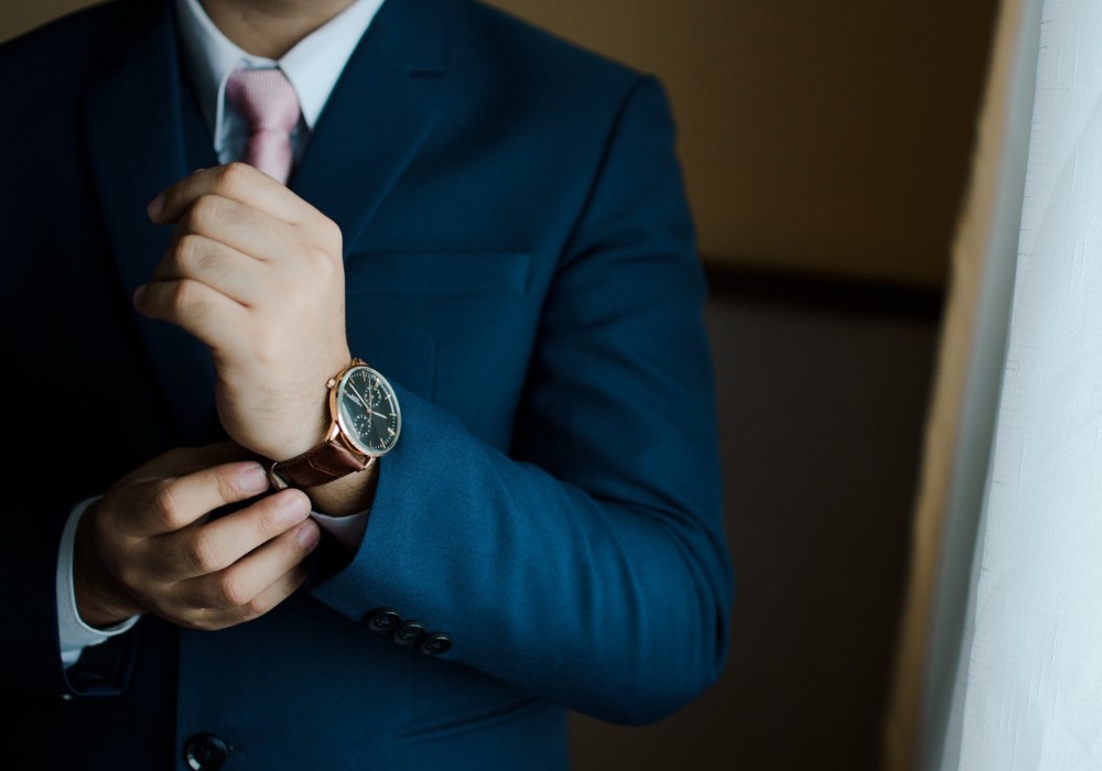 hands fastening a watch on wrist