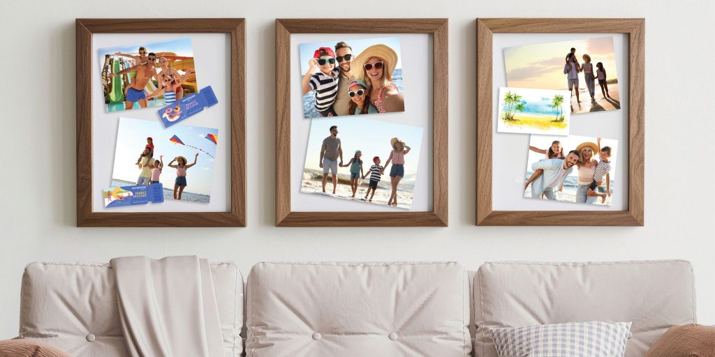 three custom frames with float mounted family photographs hanging above couch