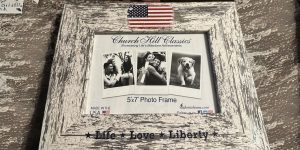 closeup of distressed white frame with american flag and life love liberty printing