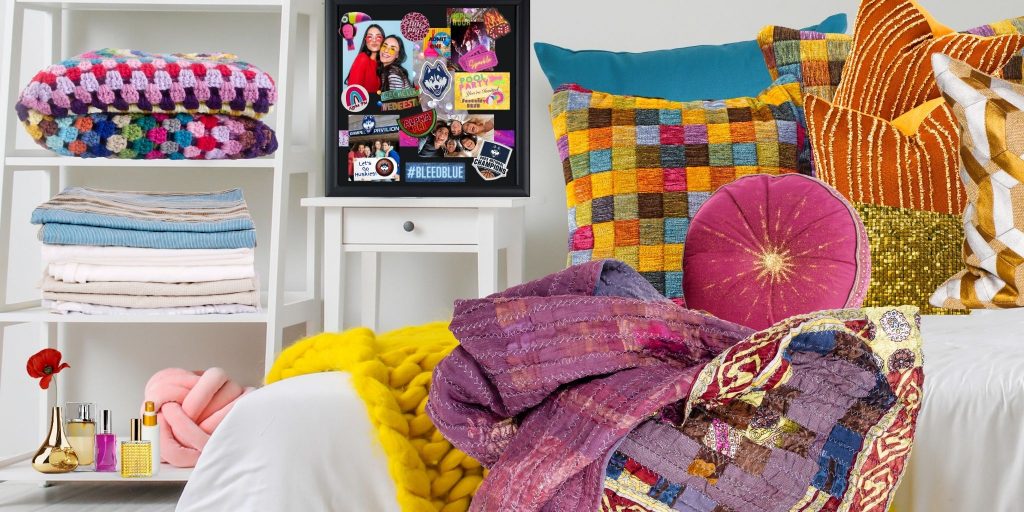 various cozy pillows and blankets on bed in dorm room and custom shadow box on side table