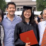 smiling family celebrating their daughter graduating from MIT