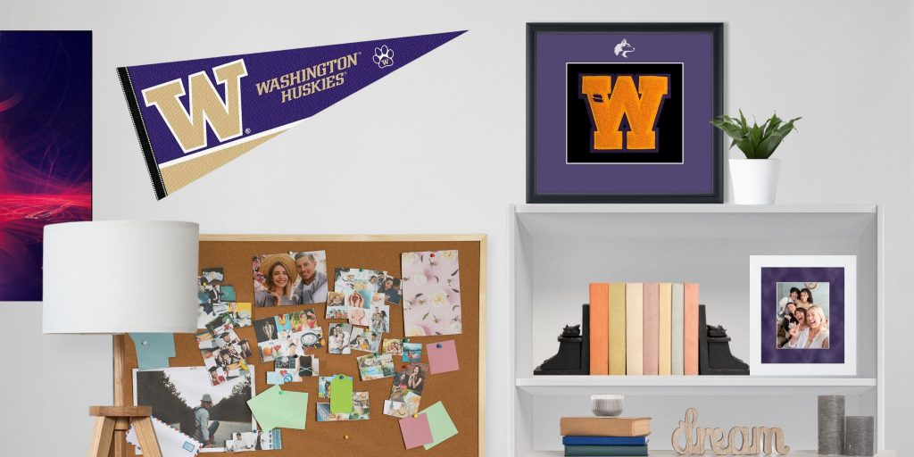 college form room with washington huskies pennant flag, cork board with notes, and bookcase with custom varsity letter and photo frames on it