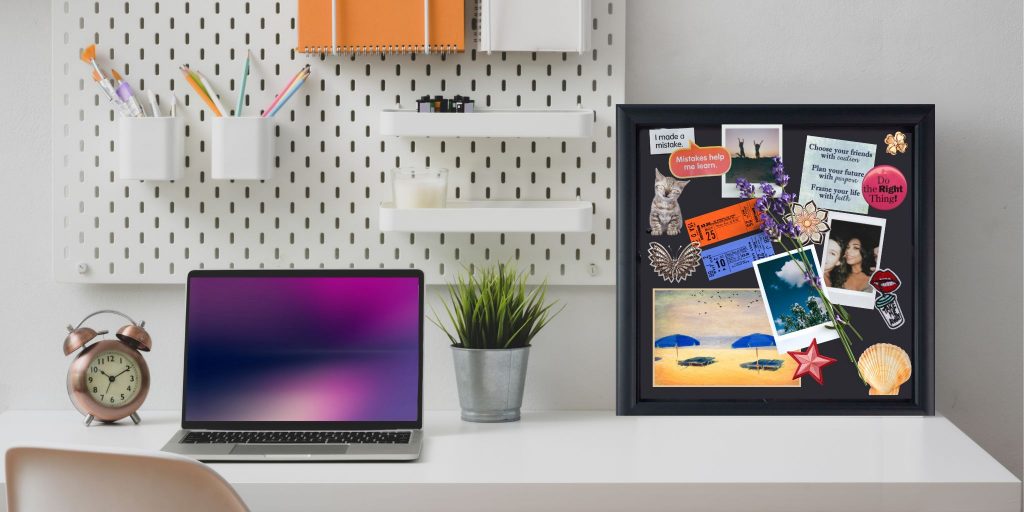 college room desk with organizational tools hung behind and laptop and keepsake shadow box frame set on top of desk