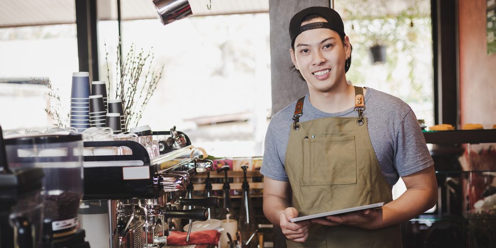 college student working as a barista at a coffee shop