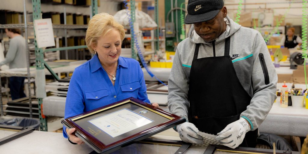 Lucie Voves and employee on Church Hill Classics production floor