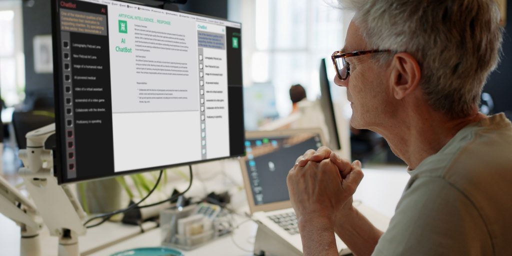 Side profile of person with glasses looking at AI chat on laptop.