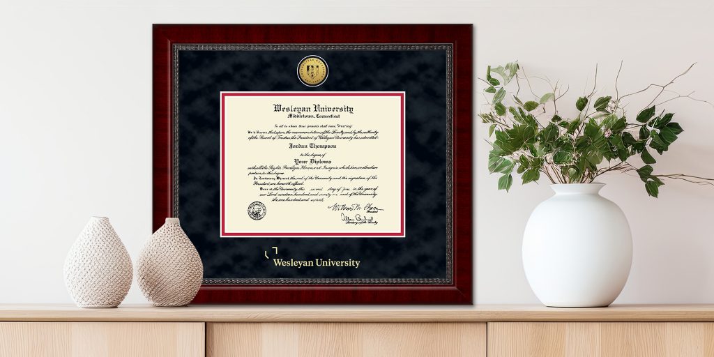Wesleyan College diploma frame on a shelf behind vases