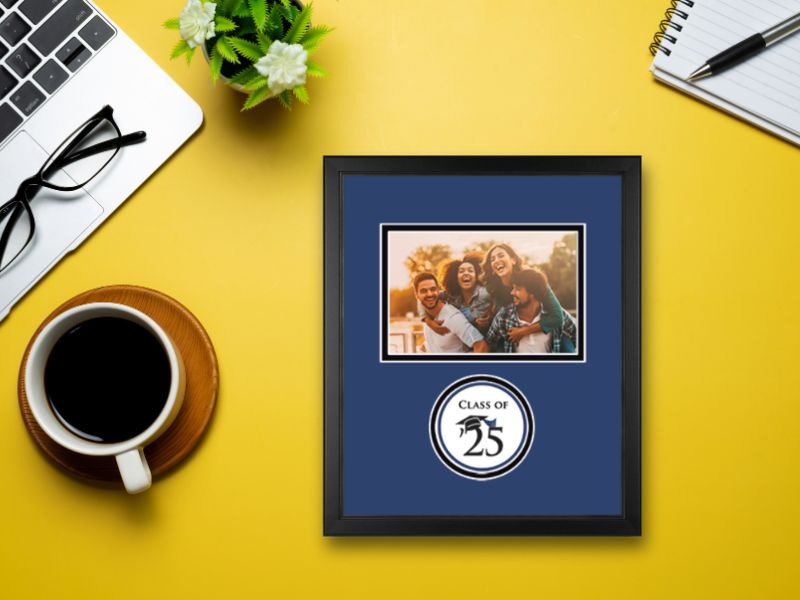 custom Class Of photo frame sitting on a yellow desk next to coffee mug