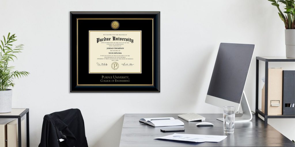 custom purdue university diploma frame hanging on a wall above a professional office space