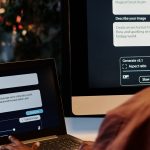 Person with their back to camera working on a laptop writing requests on AI image platform.