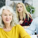 Older people sitting in college class and learning.