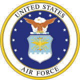 Official seal of the United States Air Force featuring a bald eagle above a shield with a starburst design, enclosed in a blue and gold circular border.