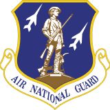 Official Air National Guard emblem featuring a colonial minuteman standing between two jet aircraft on a blue shield.