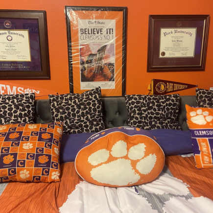 wall with diploma frames and Clemson decor
