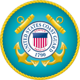 Official seal of the United States Coast Guard displaying crossed anchors and the Coast Guard crest on a turquoise circular background.