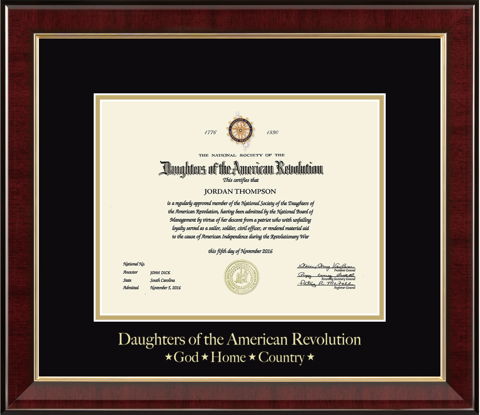 Framed ‘Daughters of the American Revolution’ membership certificate with gold accents and a dark red wood frame.