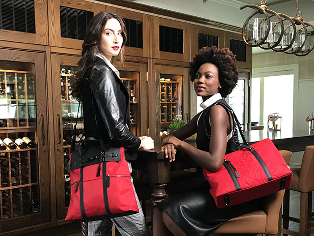 two woman wearing same brand bags