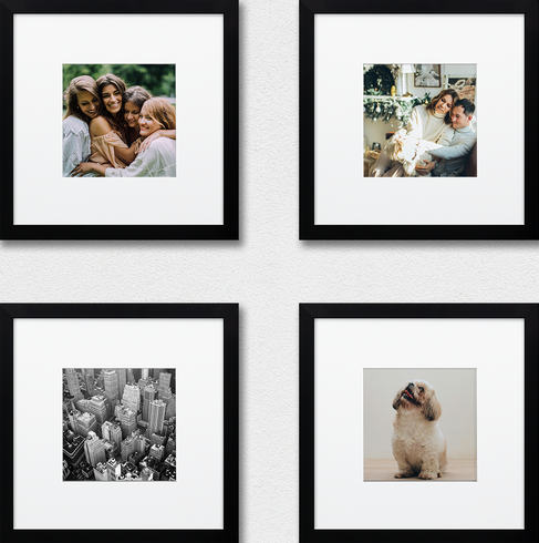 Set of four black-framed square photographs arranged in a grid on a white wall, including portraits, cityscape photography, and a dog portrait.