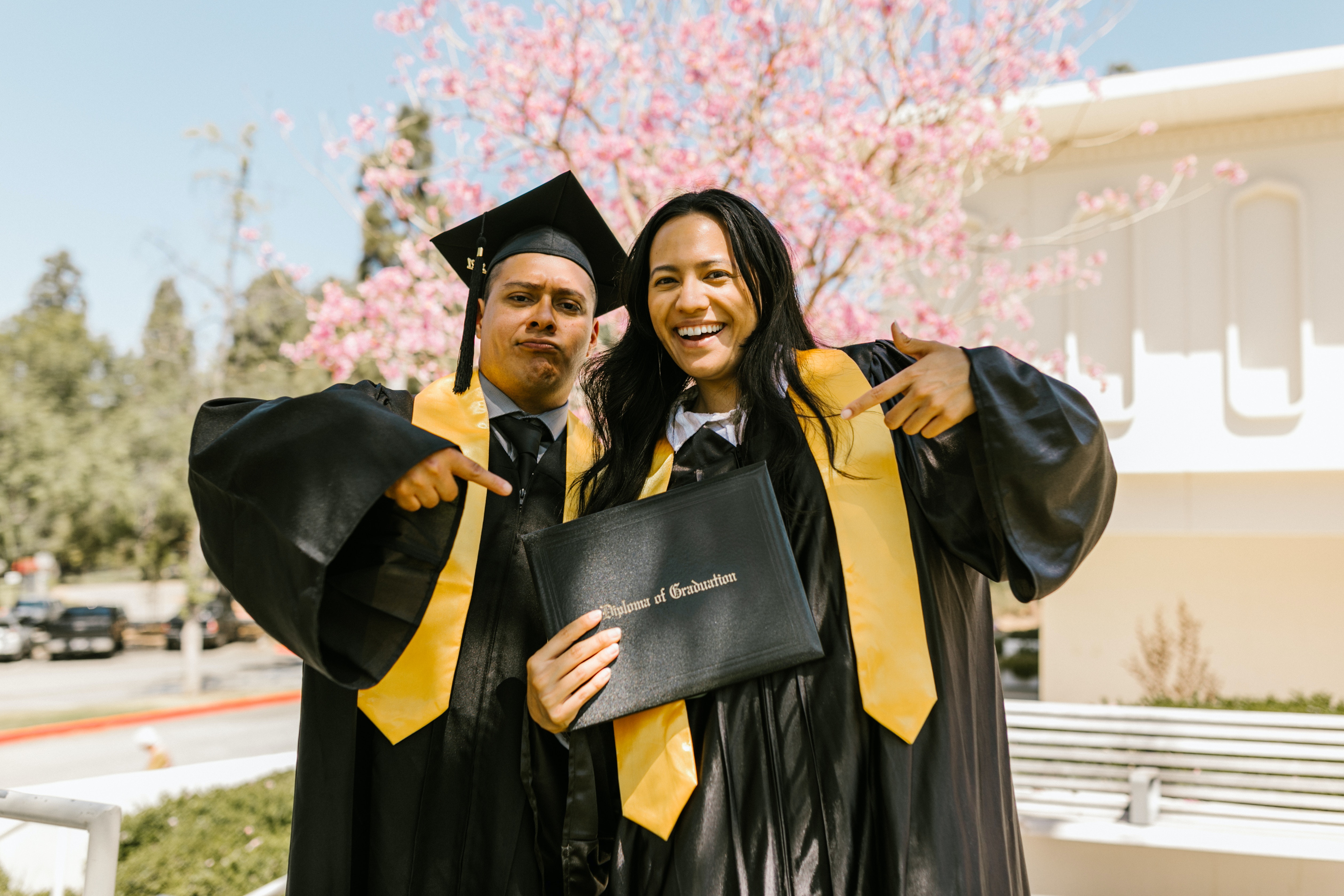 Two Graduates Holding a Diploma - Church Hill Classics