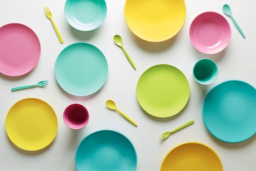 pastel plastic plates spoons and cups