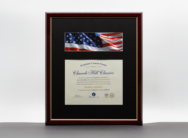 Framed certificate with a black mat, dark wood frame, and American flag image mounted above the document.