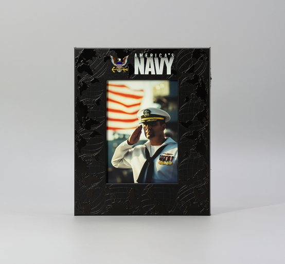 Decorative photo frame featuring a portrait of a U.S. Navy service member saluting in front of an American flag, with ‘America’s Navy’ branding.
