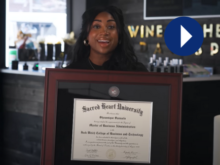 Verified customer photo for Shawnique S., sharing their experience with Church Hill Classics diploma frames, next to a play icon (video thumbnail)