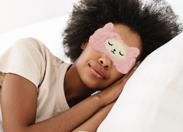 woman in bed with sleep mask on