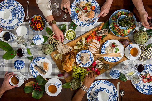 People hands with food on table