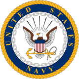 Official seal of the United States Navy featuring a bald eagle, shield, anchor, and ship’s wheel within a circular rope border.