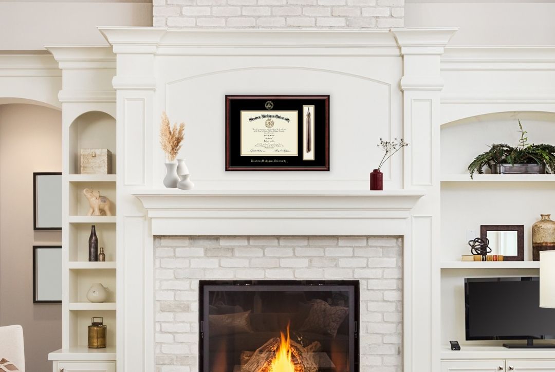 Western Michigan University tassel frame above fireplace