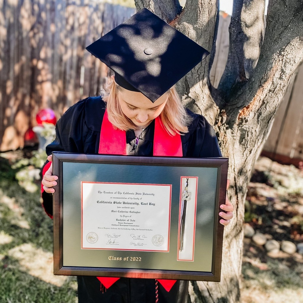 Grad Showing off her Custom Class of 2022 Tassel Diploma Frame