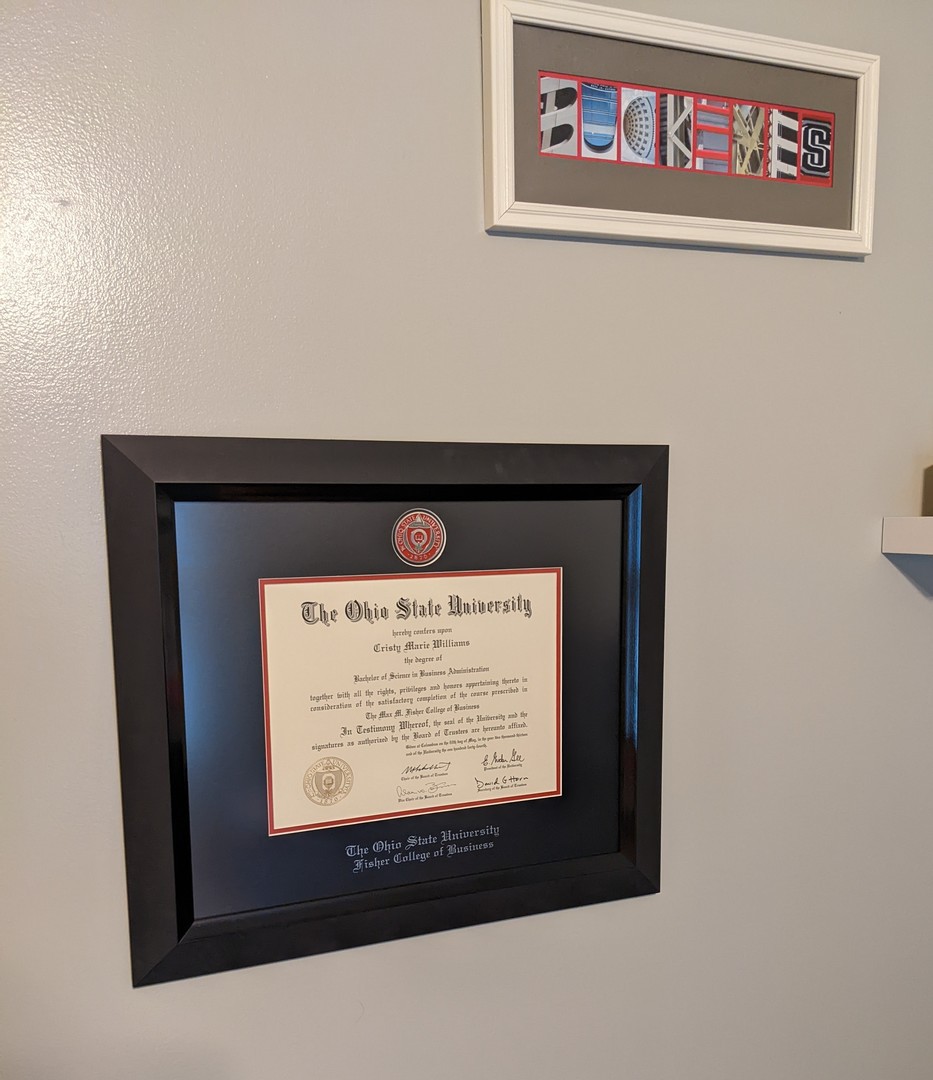 The OSU Fisher College of Business grad school masterpiece diploma frame hanging on wall
