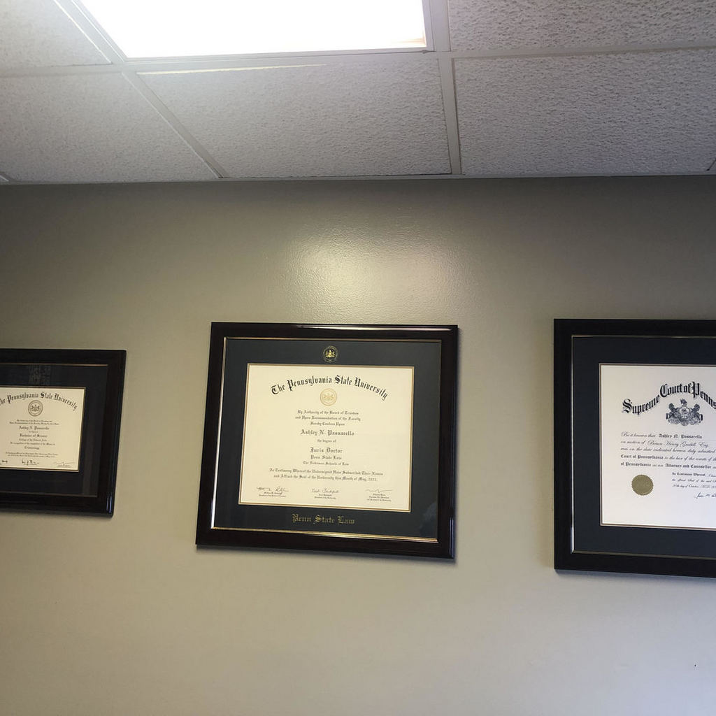 Wall of three custom certificate frames and Pennsylvania State University diploma frames