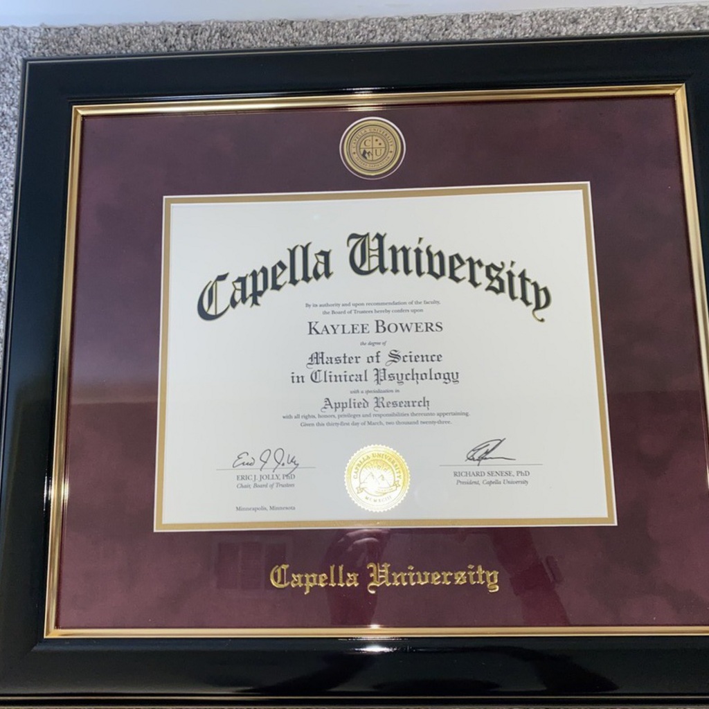 Capella University black frame with maroon suede mat